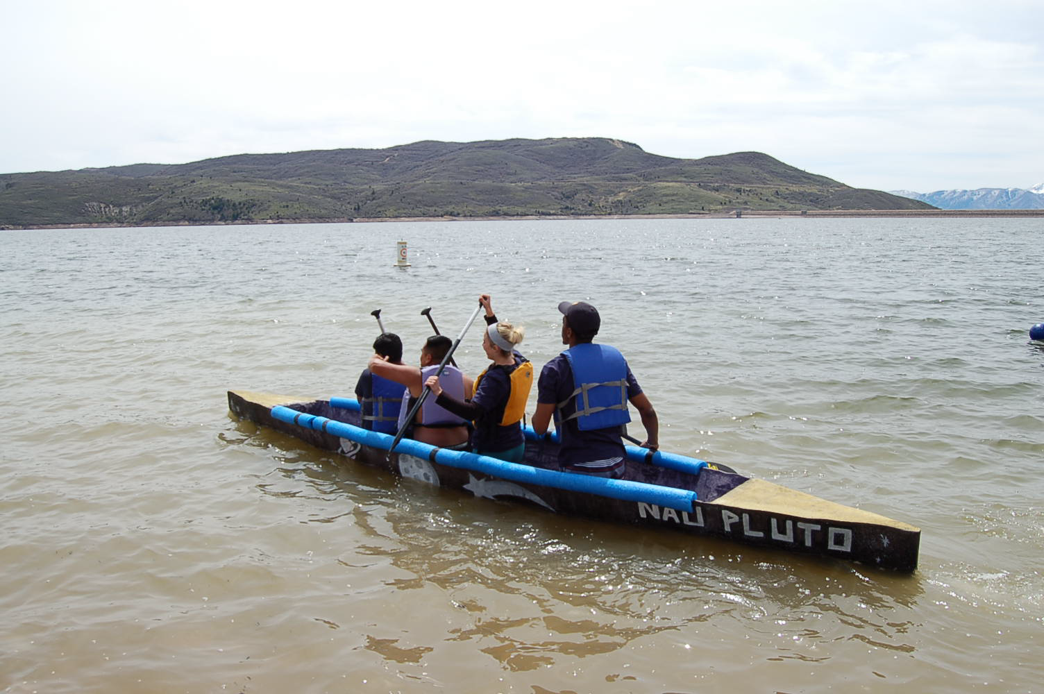 NAU PLUTO Jacks canoe on water with paddlers